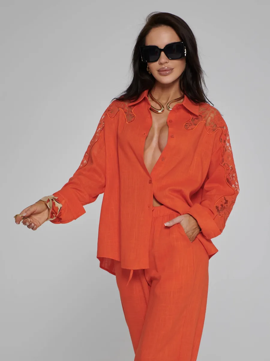 Оранжевый костюм женский брючный