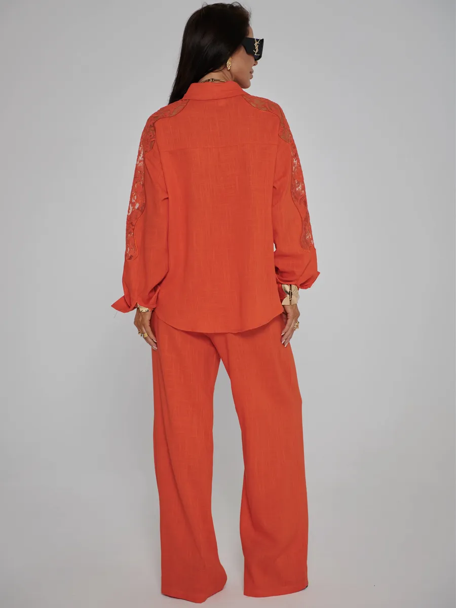 Оранжевый костюм женский брючный