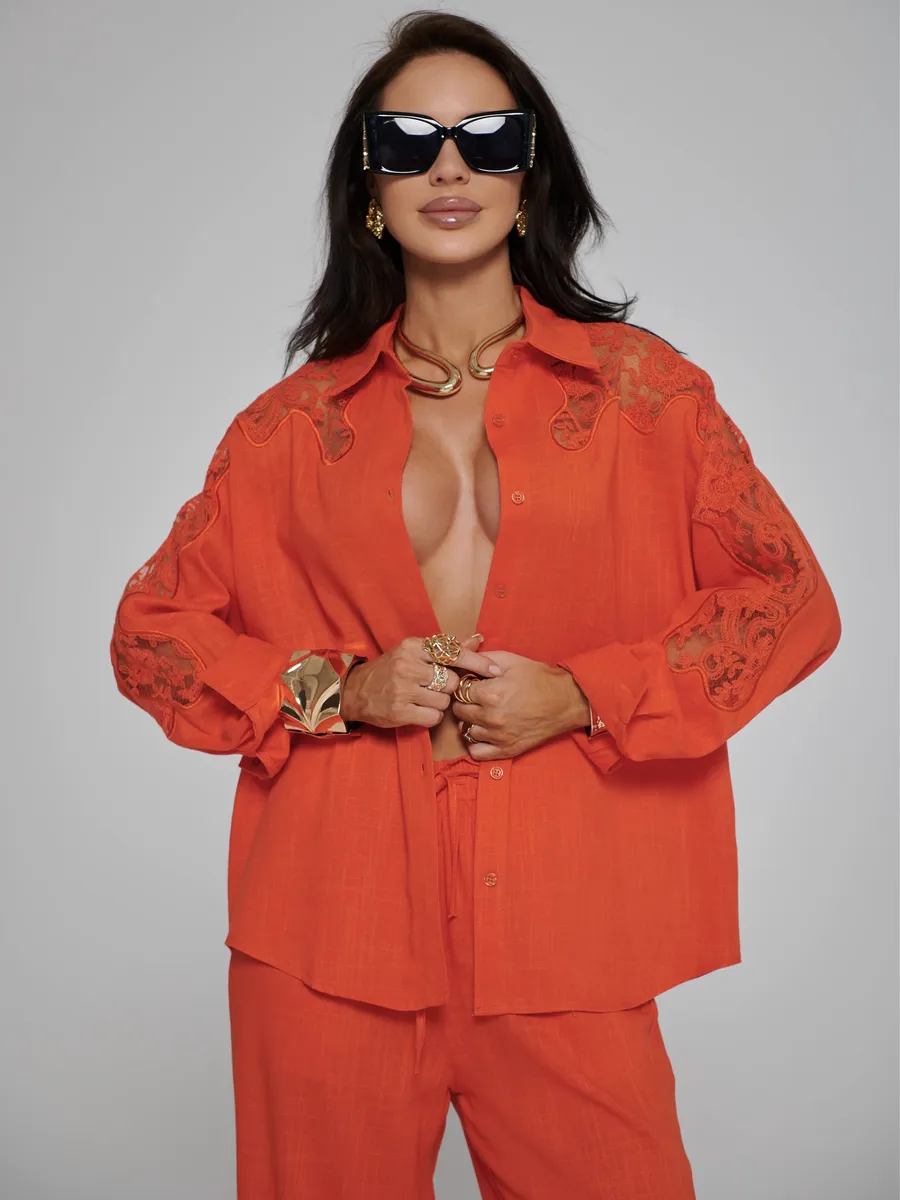 Оранжевый костюм женский брючный