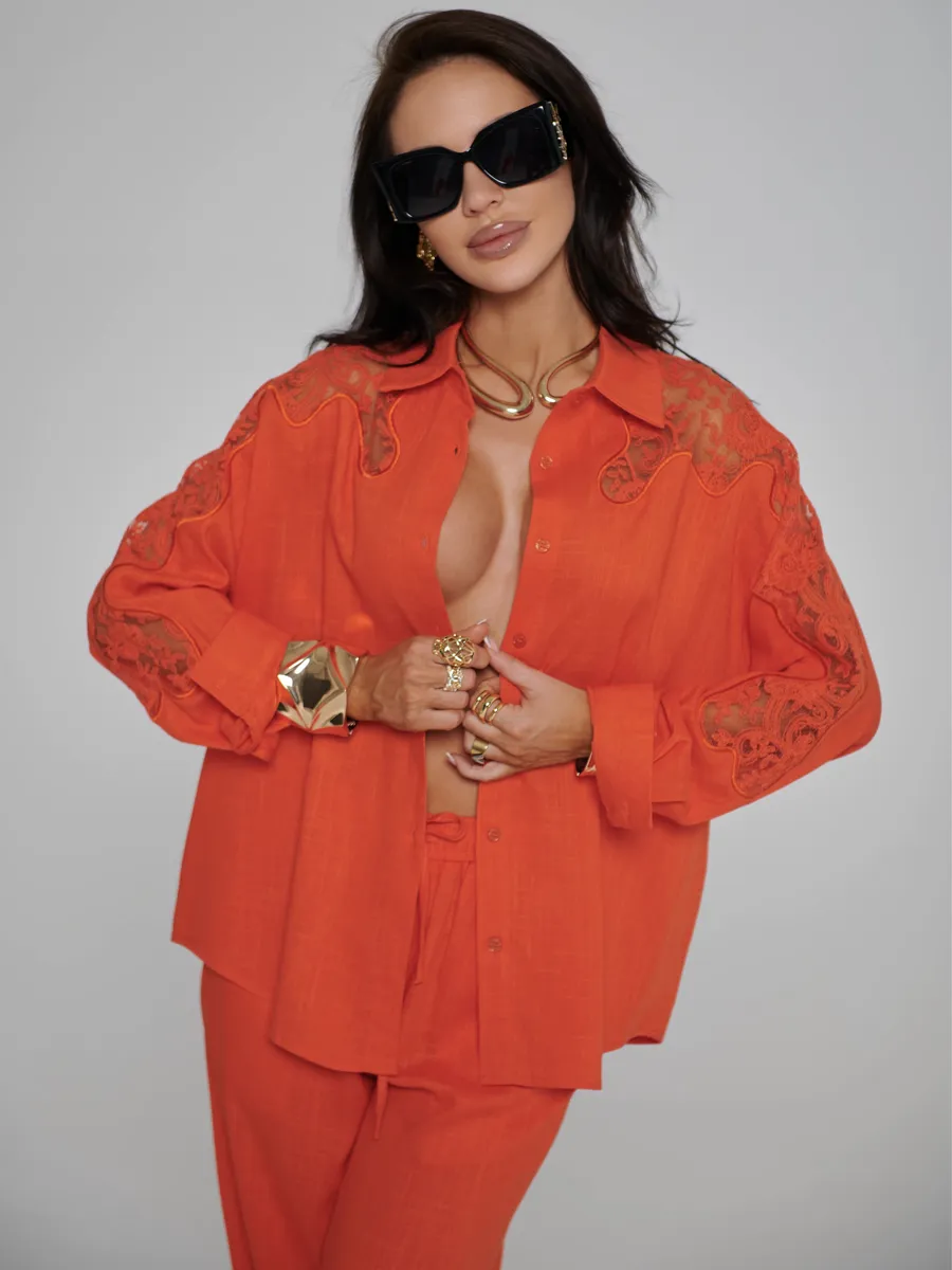 Оранжевый костюм женский брючный