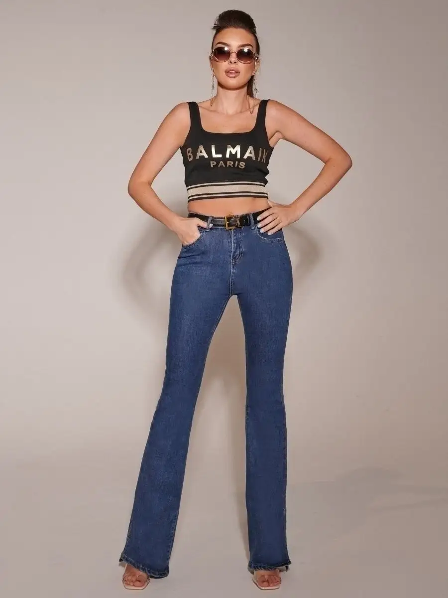 Джинсы клеш от колена с разрезами