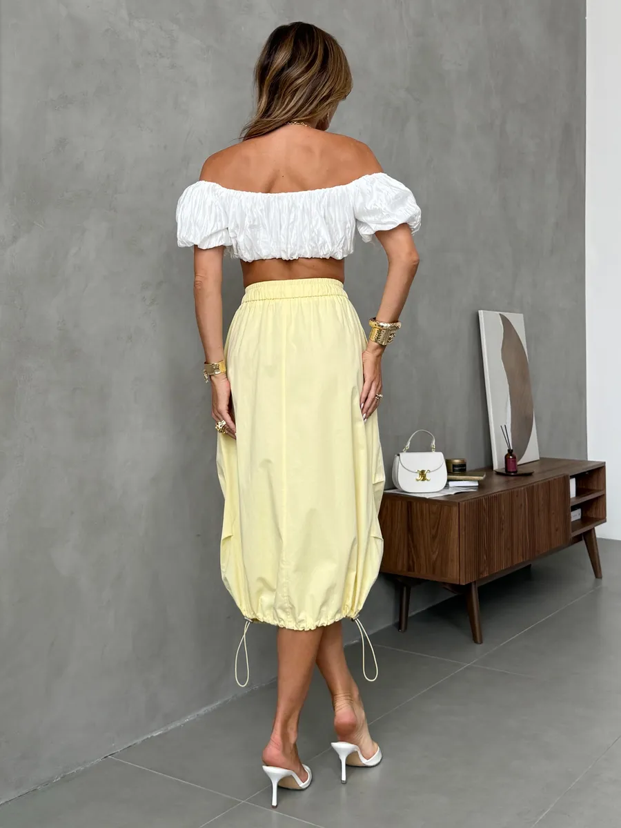 Желтая длинная летняя юбка миди